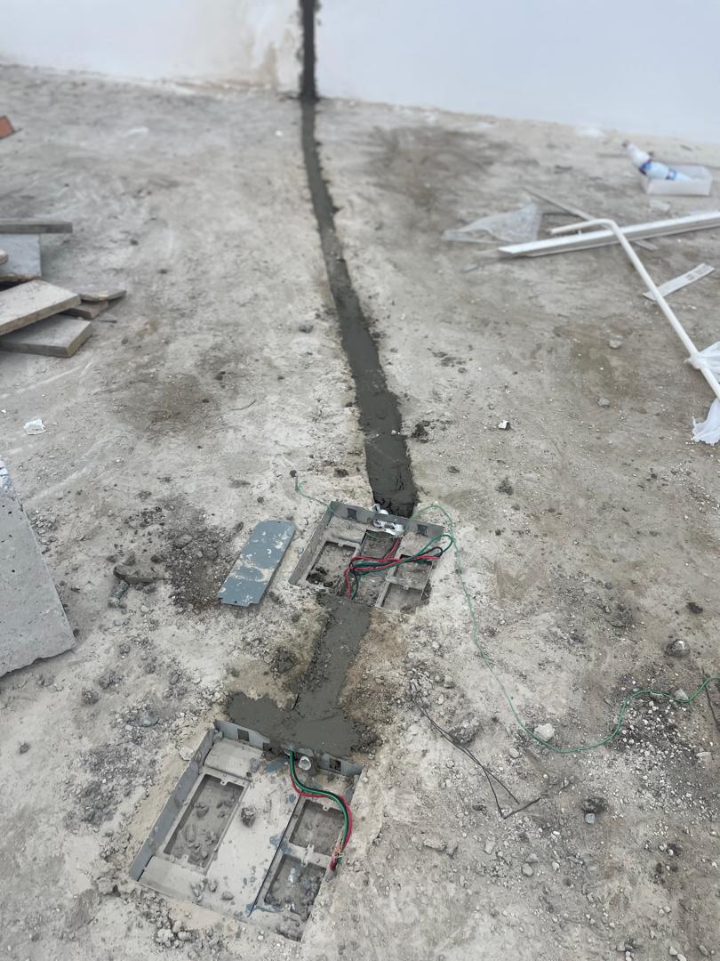 Underfloor electrical trunking and floor outlet box installation
